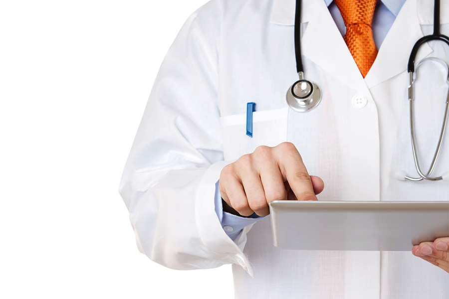 A doctor interacting with a tablet.